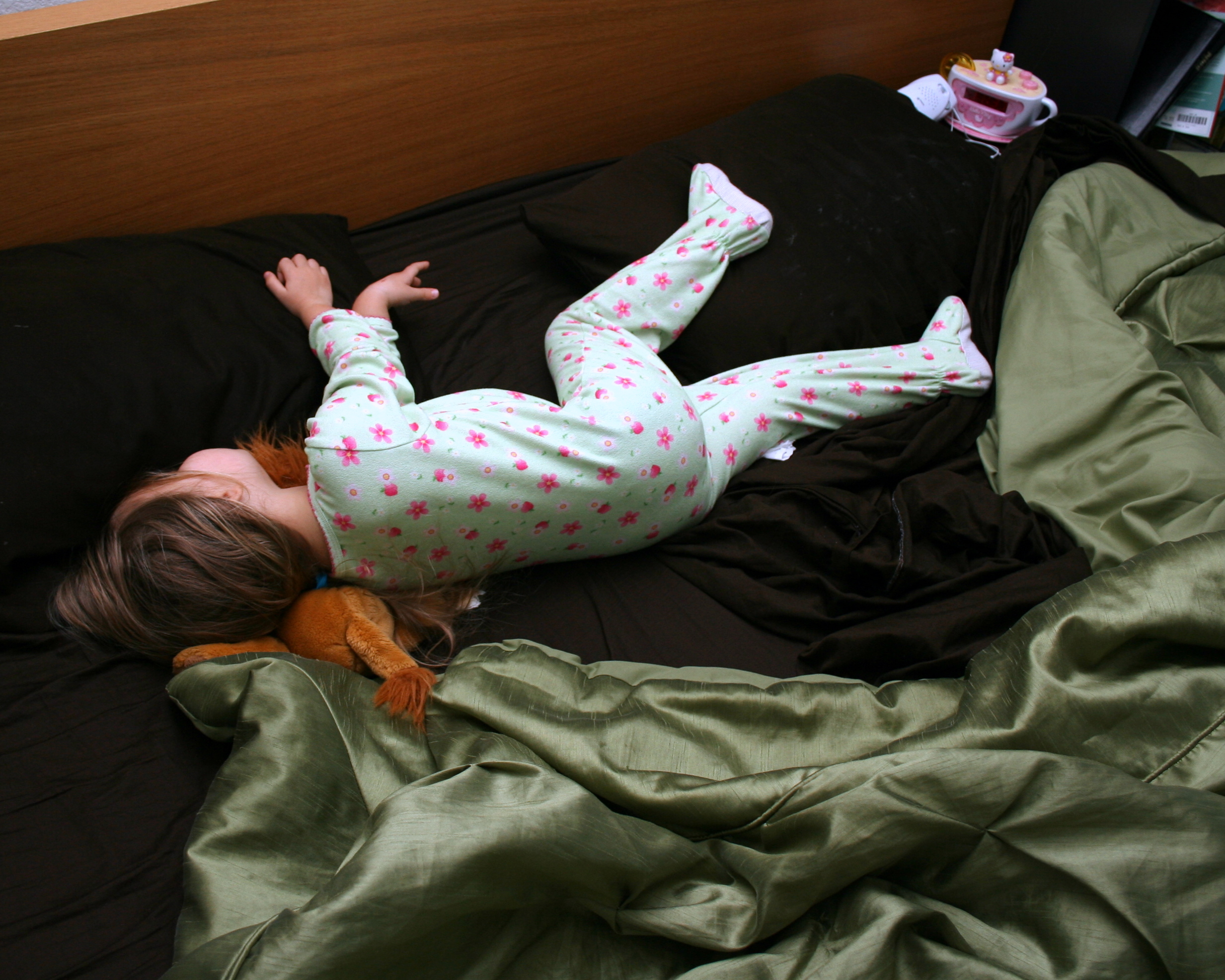 Little Girl Laying In Bed